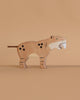 The Holztiger Saber-Toothed Tiger is a handcrafted wooden toy featuring painted spots, stripes, and white fangs. Made in Europe with great attention to detail, it stands out against a plain beige background.