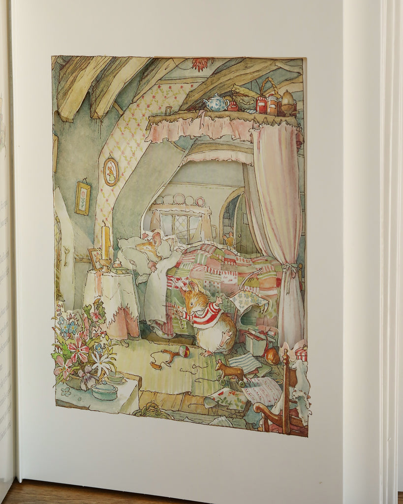 An enchanting attic bedroom illustration evokes the charm of The Brambly Hedge Pop-Up Book by Jill Barklem, with a girl and cat among flowers and scattered treasures, creating a whimsical, cozy scene.