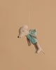 The Maileg Fairy Mouse, Little - Mint is a small plush dressed in a mint outfit with soft wings, hanging by a string against a plain beige background.