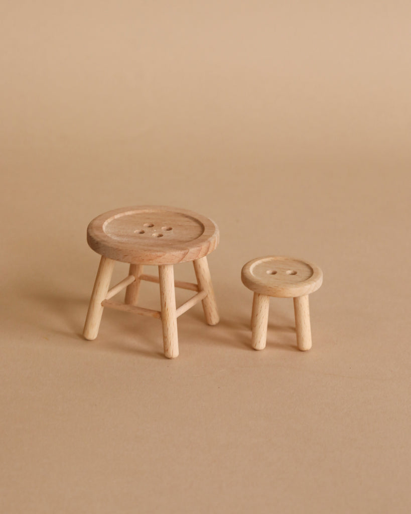 On a plain beige background sits the Maileg On The Go Suitcase Set—two charming suitcases, one larger than the other—perfect accessories for your Maileg mouse collection or dollhouse adventures.