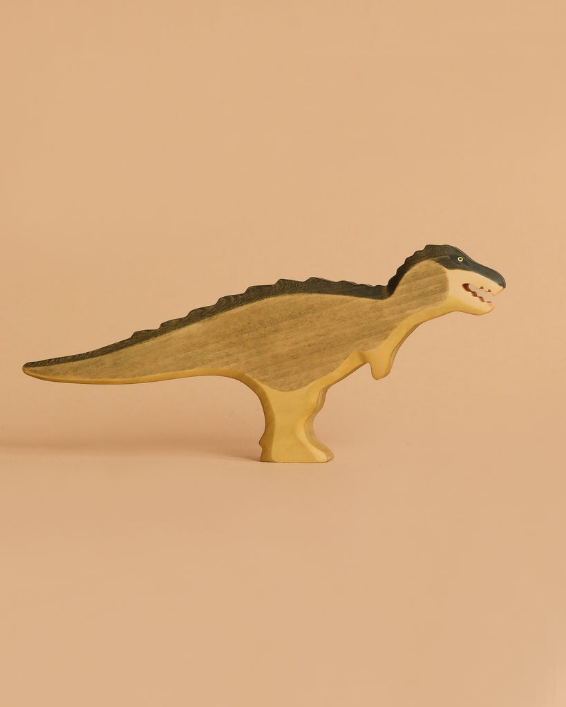 The Handmade Holzwald T-Rex Green—a handcrafted wooden dinosaur painted in green—stands upright, ideal for imaginative play and a great addition to any sustainable toy collection.