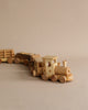 A Handmade Wooden Train - Extra Long with multiple carriages on a neutral background, featuring simple, smooth designs and natural wood tones.