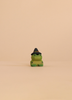A small Bumbu handmade wooden frog figurine from the Haunted Tree Halloween Set, wearing a black witch’s hat with an orange band, perfect for sustainable wooden Halloween decorations.