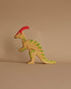 Handmade Holztiger Wooden Dinosaur Set figure with a red crest and green striped patterns, designed for imaginative play.