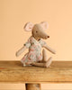 The Maileg Mommy and Me Set features a mouse doll with large ears in a patterned dress, sitting on a rustic wooden surface against a plain beige background.