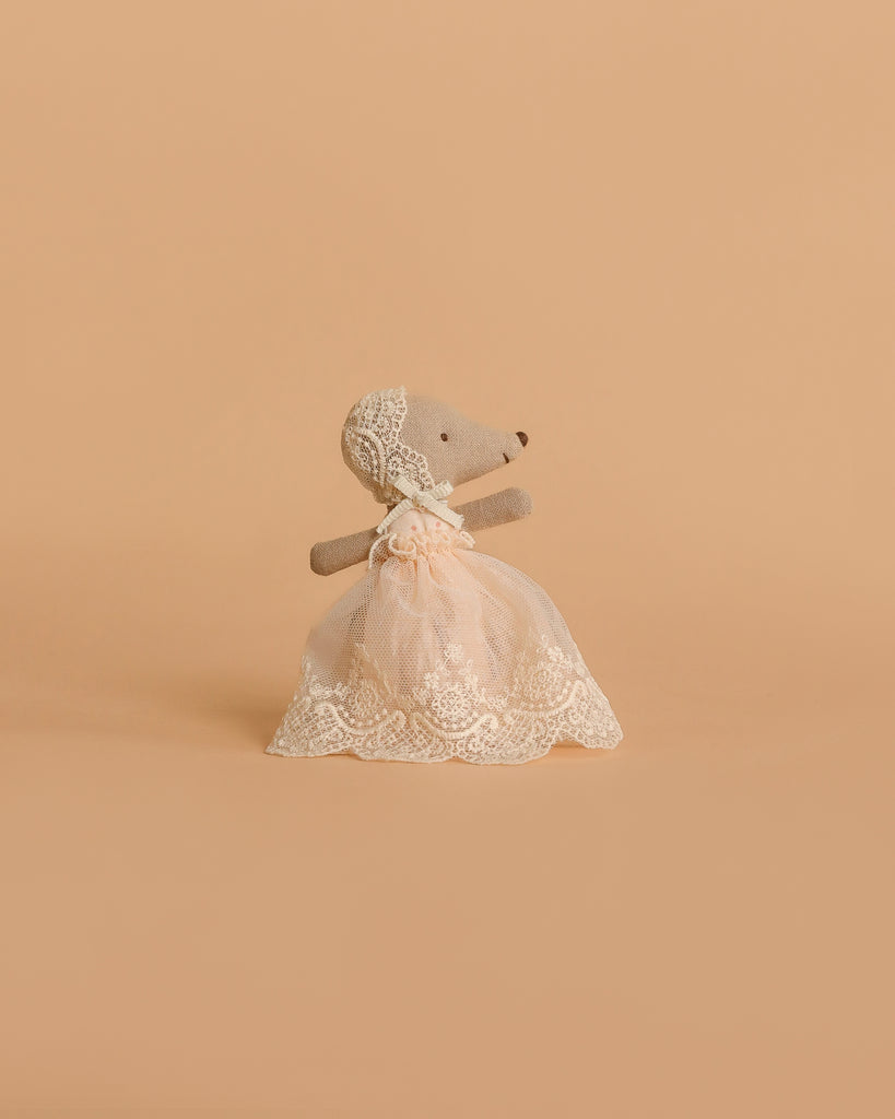 Maileg Big Sister and Me Nursery Set featuring a Big Sister mouse toy dressed in a white lace dress and bonnet, standing upright against a plain beige background.
