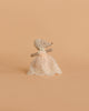 A Maileg Big Sister and Me Set features a small mouse in a white lace dress and bonnet, posed against a plain beige background.