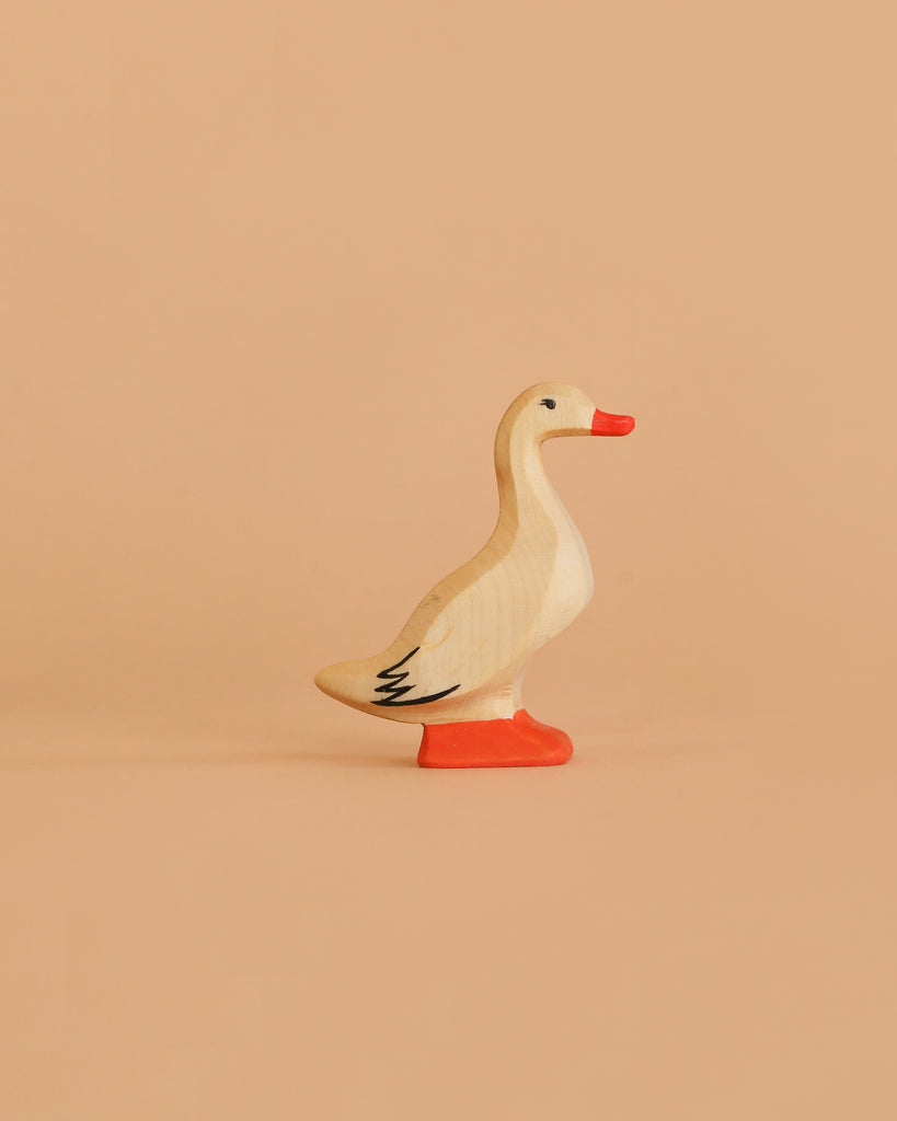 The Bumbu Handmade Wooden Woodland Animals Set features eco-friendly, hand-painted wooden duck figurines with orange beaks and feet, painted eyes, and black wing details—perfect for collectors of handcrafted animal toys.