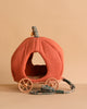 The Maileg Royal Pumpkin Carriage Set features a plush, pumpkin-shaped carriage with orange fabric, four wooden wheels, and green floral-patterned stem and reins—ideal for royal twin mice or a princess and prince mouse.