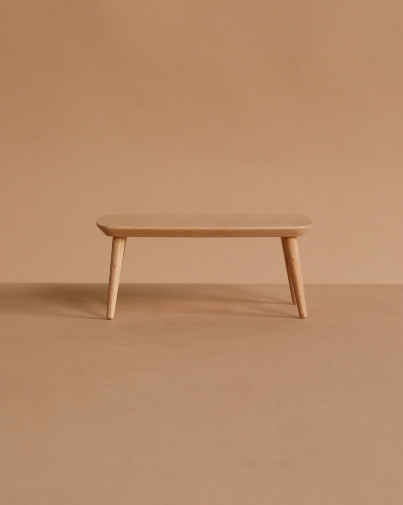 Small wooden coffee table for the Maileg Christmas Living Room Set, featuring four tapered legs.