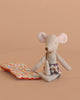 The Maileg Beach Mouse with Air Mattress - Dad wears plaid shorts and sits beside his air mattress on a plain beige background, ready for a cozy summer set—no extra bedding needed.