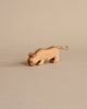 The Ostheimer Handmade Wooden Safari Animals Set features a handcrafted wooden big cat figurine with simple carved details and a rope tail, perfect for imaginative play, set against a plain beige background.