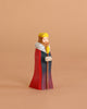 The Bumbu Handmade Wooden King, wearing a yellow crown and colorful robe with a scepter, stands against a beige background—ideal for medieval-themed playsets.