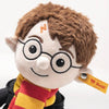 The Steiff Harry Potter Plush 11" features round glasses, brown hair, a lightning scar, and a red and yellow scarf with a black robe. A yellow Steiff tag on its ear makes it the ideal collectible Hogwarts stuffed toy.