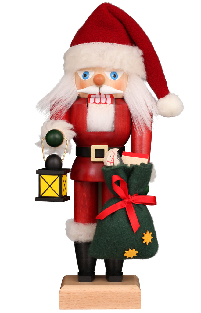 Christian Ulbricht Collectible Wooden Nutcracker - Santa with Lantern, depicted holding a lantern in one hand and a green gift sack filled with toys in the other.