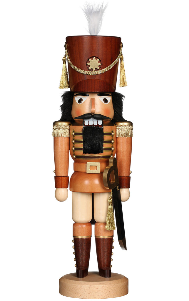 A limited-edition Christian Ulbricht Collectible Wooden Nutcracker - Soldier, dressed in a red and brown uniform with gold accents and a tall feathered hat, stands upright. It features a large, grinning mouth and holds a sword in its right hand, embodying timeless charm.