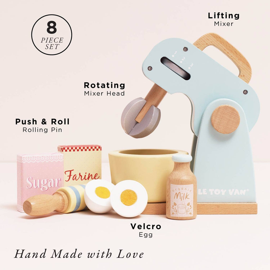 The Bakers Mixer Set & Accessories is a pastel wooden toy kitchen set with a mixer (rotating head, lifting feature), rolling pin, milk bottle, sugar and flour boxes, bowl, and two sliced eggs. Text reads "Hand Made with Love.