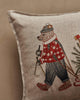 Coral & Tusk Christmas Tree Sled Pillow made of embroidered linen featuring a bear in a plaid shirt and knit hat pulling a wooden sled with a Christmas tree.