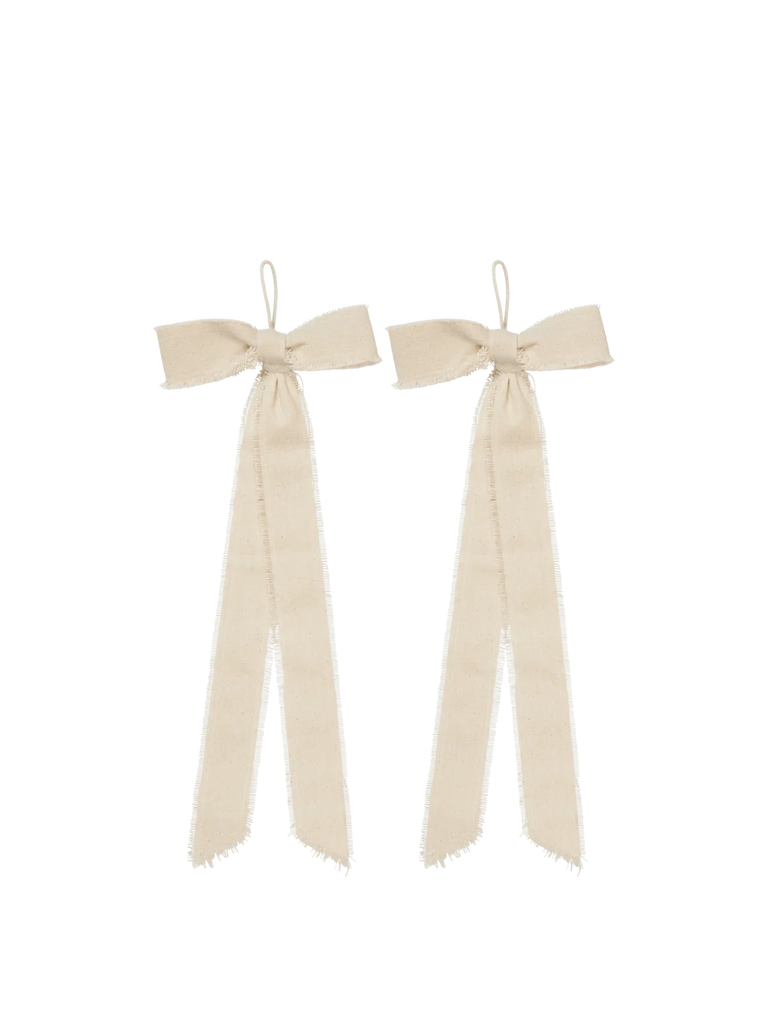 A set of two Ferm Living Bow Decoration - Small - Natural (Organic Cotton) beige bows featuring long, frayed-edge ribbons and small hanging loops, ideal for holiday décor.