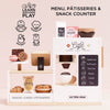 The Barista Café Shop by Le Toy Van is a wooden pretend play set with snacks, pastries, a coffee machine toy, cups, and chalkboard menu. Encourages coordination, dexterity, and imagination. Café treats and drinks are included. Ships in one week.
