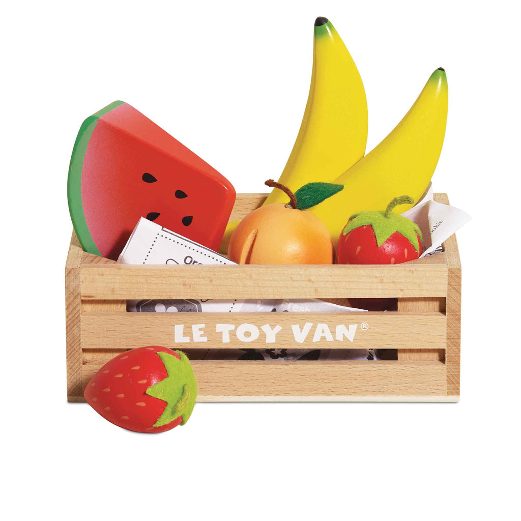 The Smoothie Fruit Wooden Market Crate (ships in one week) holds colorful wooden fruits—two bananas, a watermelon slice, an orange, and two strawberries—perfect for early learning and imaginative play.