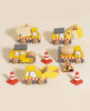 The Construction Toy Cars, Trucks & Diggers set (ships in one week) features a dump truck, excavator, road roller, and front loader with orange traffic cones and a roadwork sign for imaginative construction play on a light beige surface.