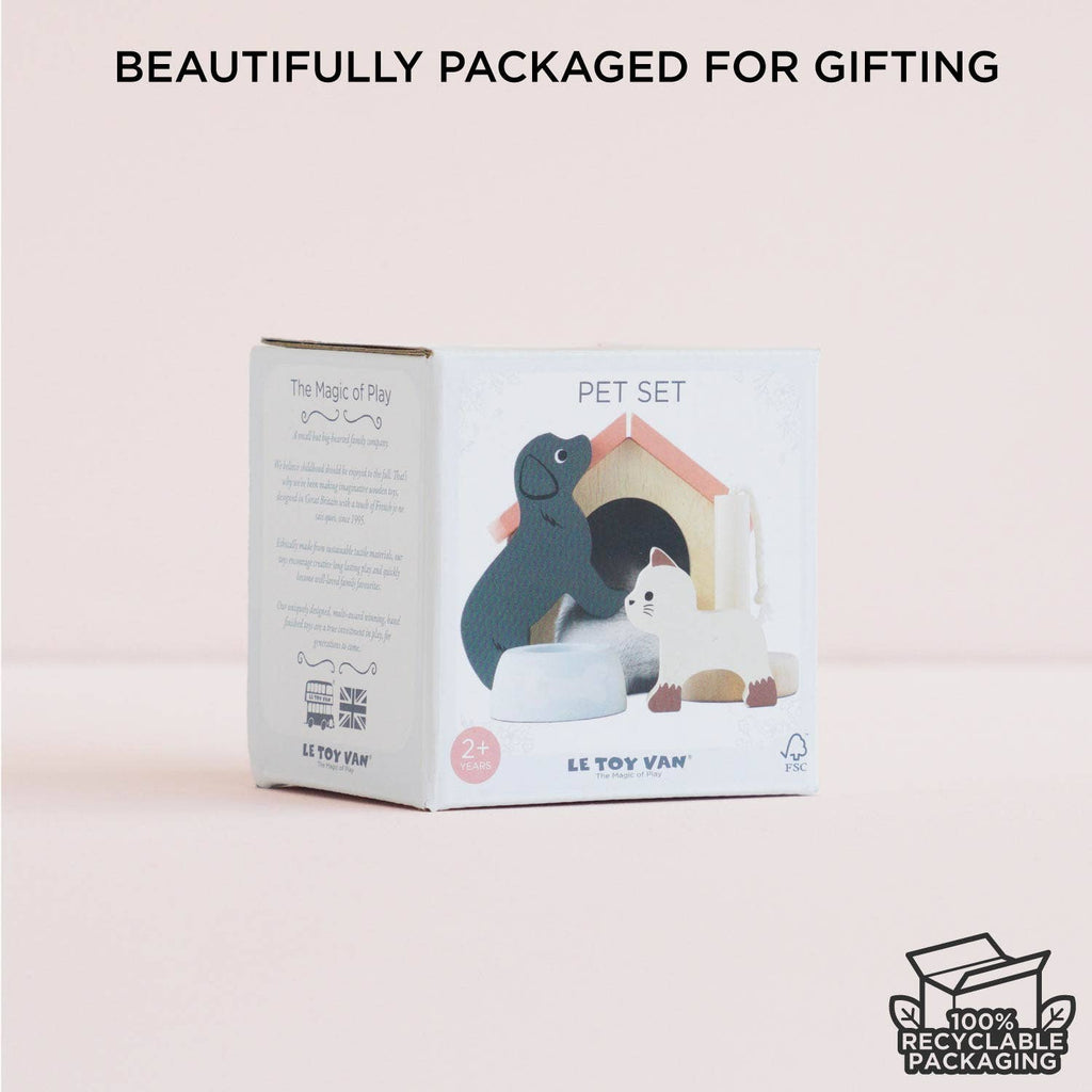 The Dolls House Pet Set by Le Toy Van includes a wooden black dog, white cat, and doghouse. Perfect for small world play, it comes in 100% recyclable packaging and is ideal for gifting.