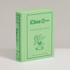 A light green Clue Jr. Vintage Bookshelf Edition board game box featuring an illustration of a child with a magnifying glass, labeled for ages 5 and up with 2 to 4 players.