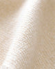 Close-up of the Cuddle + Kind Organic Cotton Baby Bunny Lovey in Oatmeal, featuring textured, off-white woven fabric with a diagonal ridge—ideal for an heirloom-quality lovey or hand-knit baby blanket.