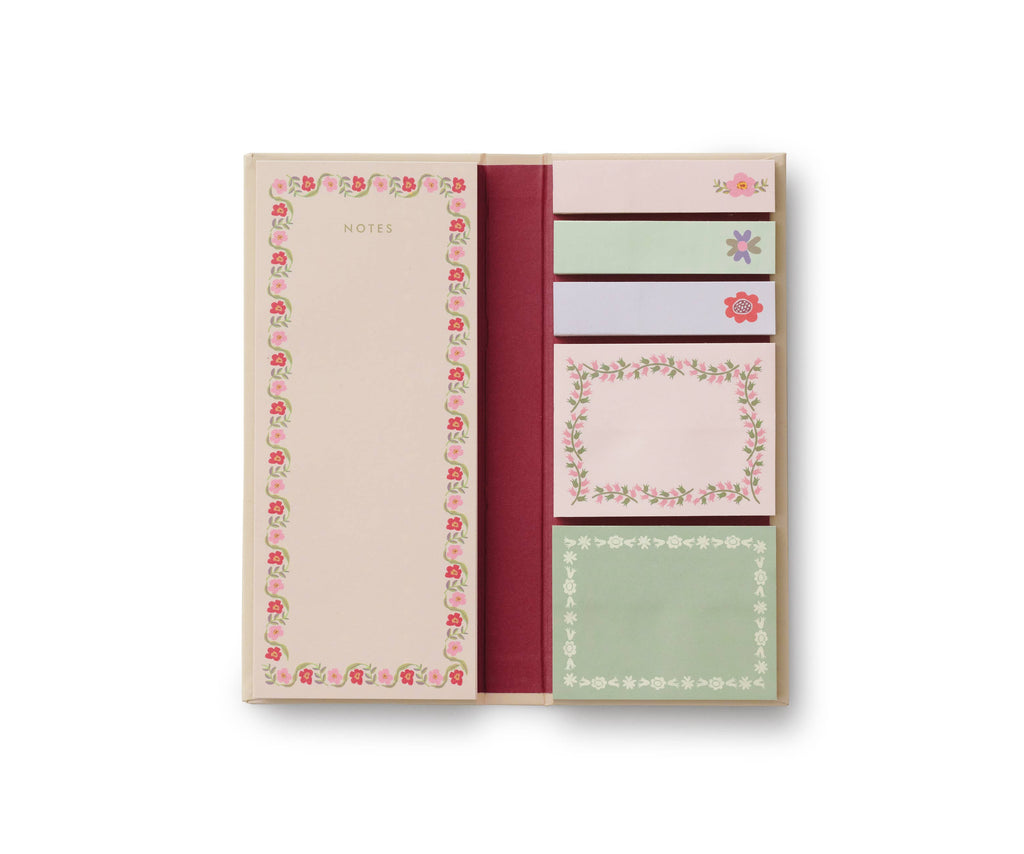 The Delphine Sticky Note Folio features a left section for large lined notes with a floral border and five pastel decorative sticky note pads on the right, all accented with the elegant Delphine pattern.