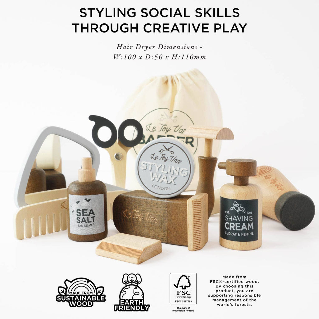 The Wooden Hairdresser & Barber Kit includes a hairdryer, scissors, comb, mirror, shaving cream, sea salt, styling wax, and brush in a drawstring bag. Plastic-free and eco-friendly—a perfect grooming kit for kids. Ships in one week.