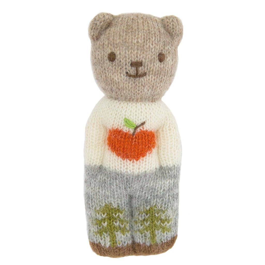 The Blabla Organic Alpaca Wool - Happy Go Lucky Bear Doll features a handmade beige head, small ears, and a smiling face, plus an orange apple sweater and gray pants with green trees—all crafted from soft organic alpaca fleece.