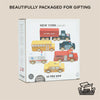 A box labeled "American Wooden Car Set" by Le Toy Van, featuring illustrations of five wooden vehicles—bus, fire truck, police car, ambulance, and taxi. Perfect for imaginative play and beautifully packaged for gifting.