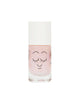 A bottle of Nailmatic pink water-based nail polish with a cute face design and smiling eyes, isolated on a white background. The cap is white and the bottle contains shimmering particles.