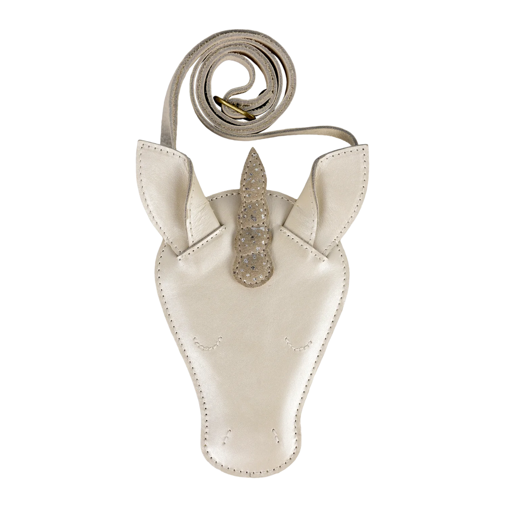 The Donsje Leather Blinc Purse - Unicorn is a cream-colored leather bag shaped like a unicorn’s head, featuring stitched details, a metallic spiral horn with small studs, pointy ears, and an adjustable strap.