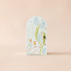 Inspired by fair trade artistry and Peruvian handmade charm, this door features a drawing of Cuddle + Kind Tiny Charlie the Honey Bear with flowers.