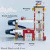 The Fire & Rescue Garage is a colorful wooden toy with ramps, a winding lift, emergency bell, swing door, and a red helicopter on top. Feature labels included. Bottom text: "Hand Made with Love.