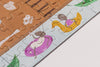 A close-up of the Beneath the Branches 200 Piece Puzzle shows cartoon ants relaxing on pool floats—one on a purple ring with a drink, another on a yellow duck—all crafted from matte pieces with green leaves and water in the background.
