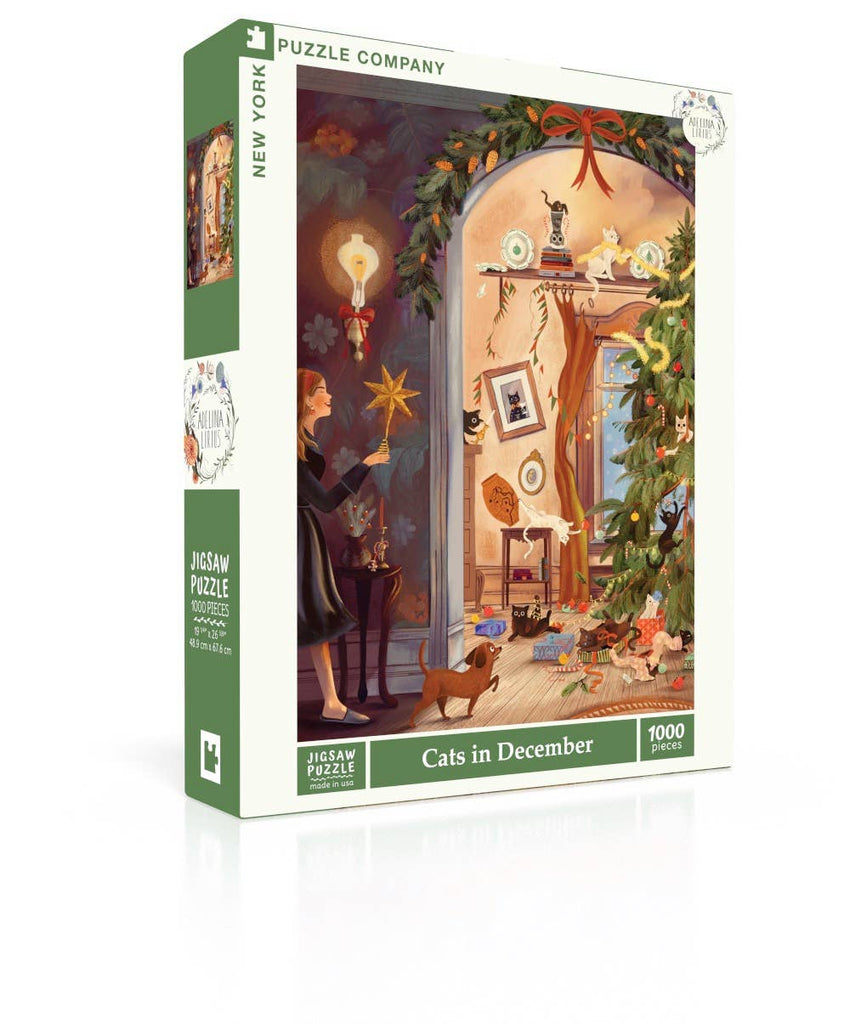 The Cats in December - 1000 Piece Jigsaw Puzzle box shows a person lighting a star ornament in a festive room as several cats play around a Christmas tree.