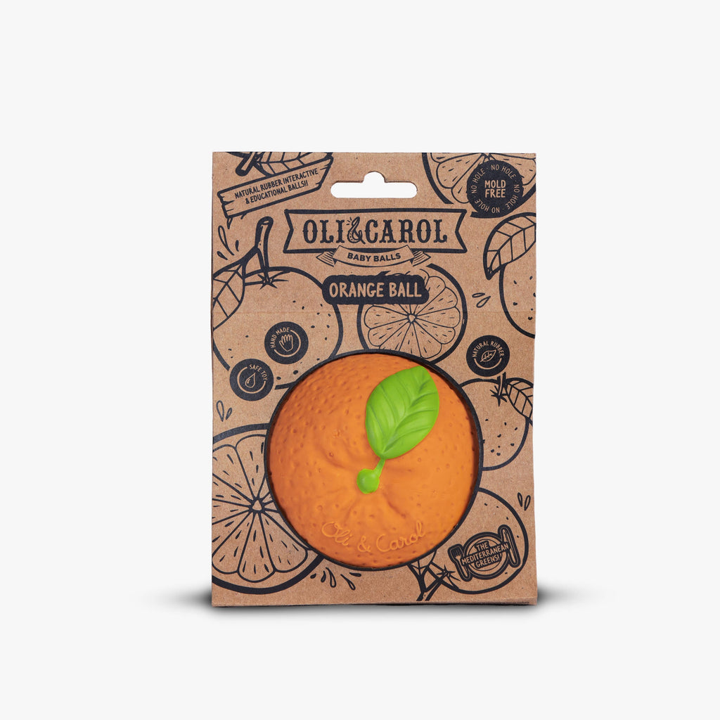 The Orange Baby Ball by Oli & Carol is a natural rubber baby toy shaped like an orange with a green leaf, packaged in eco-friendly cardboard featuring fruit designs—ideal for sensory play.