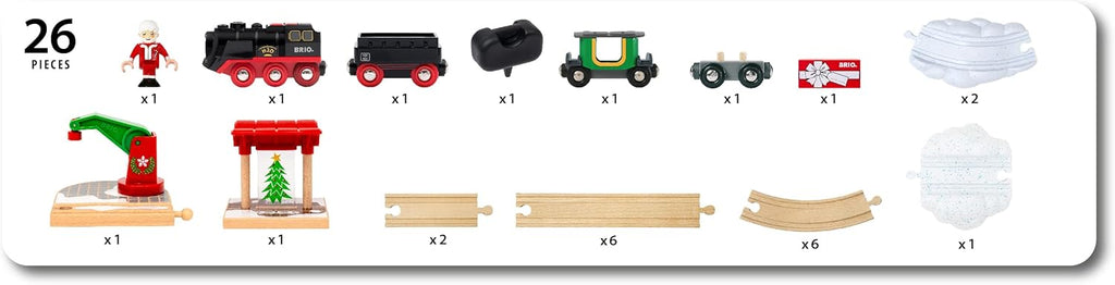 Image of the BRIO World Christmas Steaming Train Set with 26 pieces, including a figure, steaming train engine, tender, coal car, two cars, gift boxes, snow pieces, Christmas tree, toy crane, and curved and straight tracks.