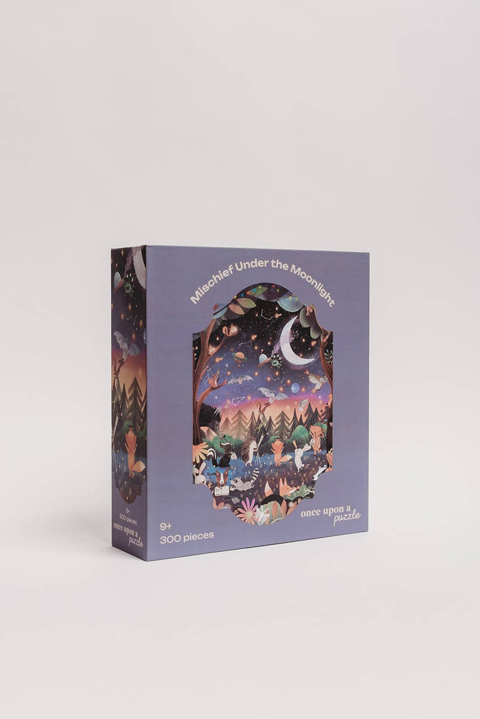 The Mischief Under the Moonlight 300 Piece Puzzle features a nighttime forest scene with animals and colorful lights. Its matte, recycled pieces come in a purple box labeled for ages 9 and up.
