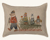 Coral & Tusk Christmas Tree Sled Pillow: a rectangular linen pillow embroidered with a bear pulling a sled loaded with a pine, accompanied by a smaller bear, a rabbit, and an owl.