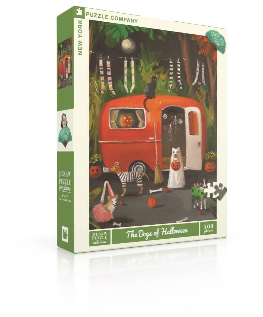 The Dogs of Halloween - 500 Piece Jigsaw Puzzle features costumed dogs near a red camper, surrounded by trees and festive décor—a perfect Halloween dogs puzzle!.
