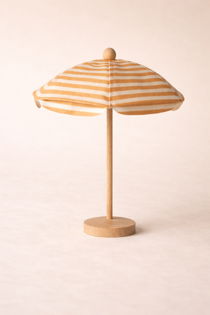 Miniature wooden sun umbrella from the Maileg Garden Tea Set, featuring a beige and white striped canopy.