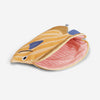 A pencil case shaped like a butterfly fish, featuring yellow and orange stripes, blue fins, and a pink padded interior, inspired by marine life.