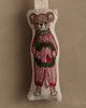 Coral & Tusk Mouse with Wreath Ornament: An embroidered mouse in red striped pajamas and green scarf, holding an evergreen wreath with a red bird, set against a neutral background.