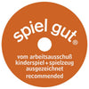 Rust-colored circular badge with white "spiel gut" text at top and "vom arbeitsausschuß kinderspiel + spielzeug ausgezeichnet recommended" below a central hole, often seen on handcrafted HOLZTIGER Squirrel, brown figure made from maple and beech wood.