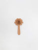 The Sabo Concept Lion Rattle - Natural is a delightful baby toy with a wooden lion face and round handle, made from natural materials and shown on a plain white background.