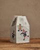 The Coral & Tusk Snow Day Tissue Box Cover features embroidered fox, bear, and rabbit making snow angels on a snowy hill, adding charming, fabric-covered decor to your space—perfect for snow days and neutral backgrounds.